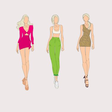El moda modelleri gri arka plan üzerine çekilmiş.