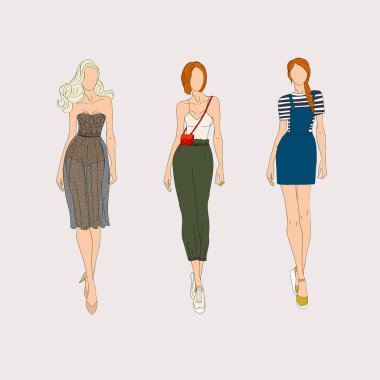 El moda modelleri gri arka plan üzerine çekilmiş.