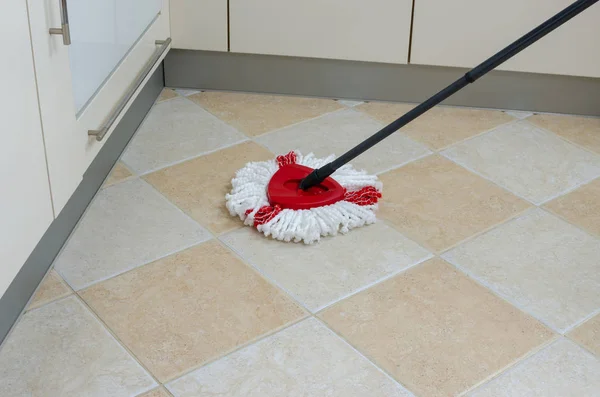 Mop on kitchen floor — Stock Photo, Image