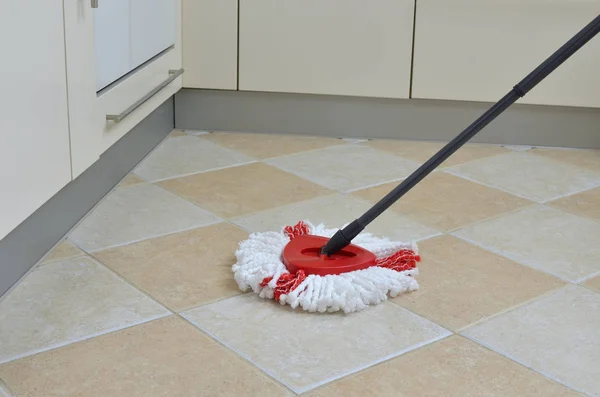 Mop on kitchen floor — Stock Photo, Image