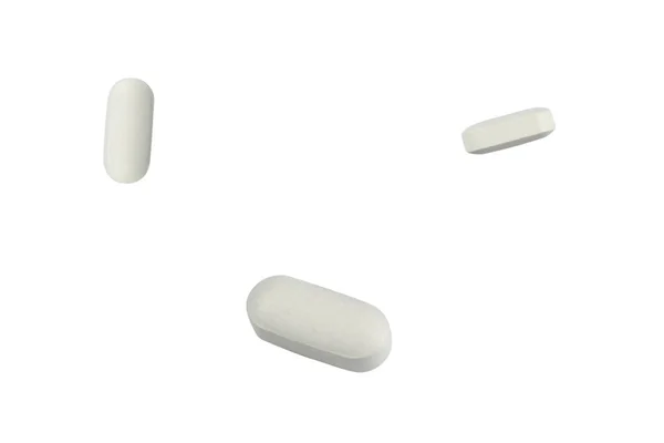 Таблетки, изолированные на белом — стоковое фото