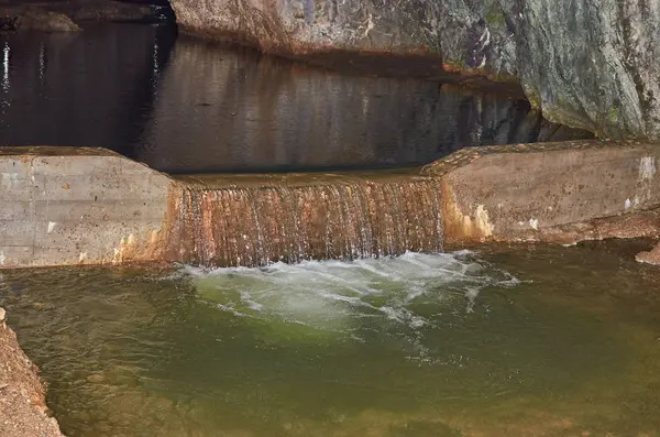 Water cascade in a cave — Stock Photo, Image