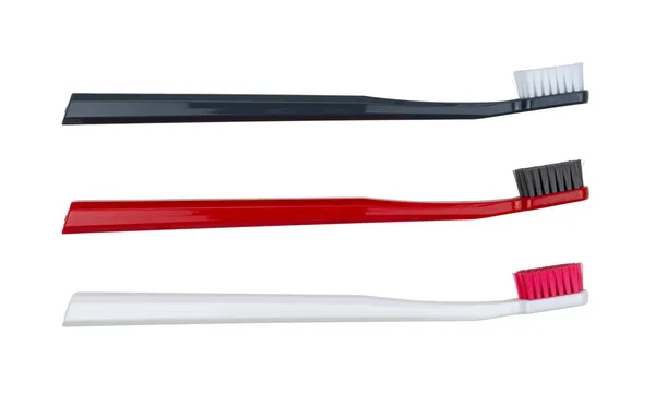 Нові Зубні Щітки Білі Червоні Чорні Ізольовані Білому Тлі Вид — стокове фото