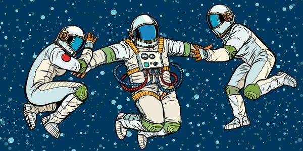 Tres astronautas en el espacio en gravedad cero — Vector de stock