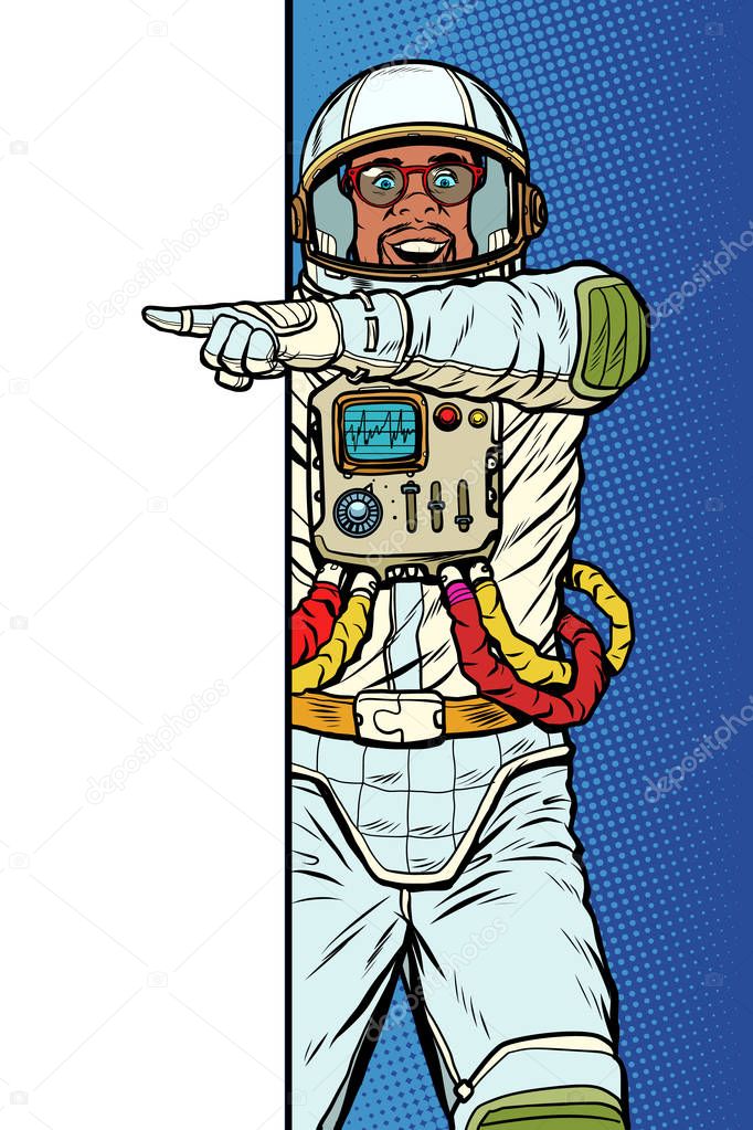 african man astronaut. Point to copy space poster