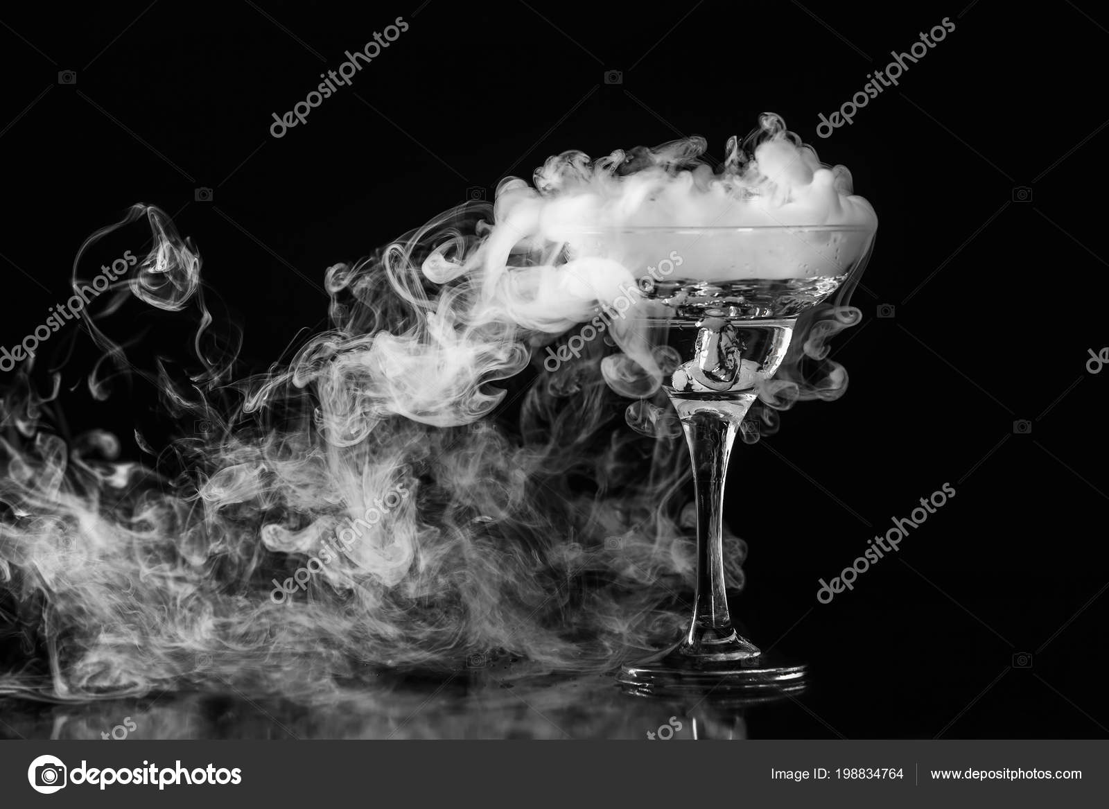 Closeup glass white fog dark background chemical reaction dry ice stock photo