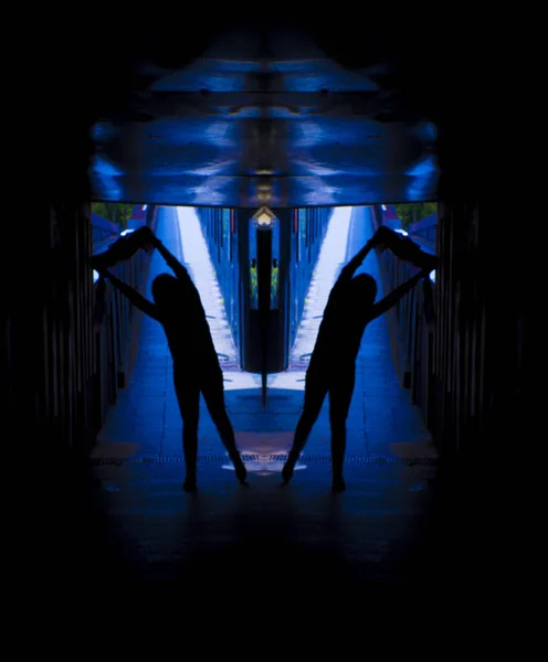 Woman alone and sad in a tunnel. Scene of mystery and desolation