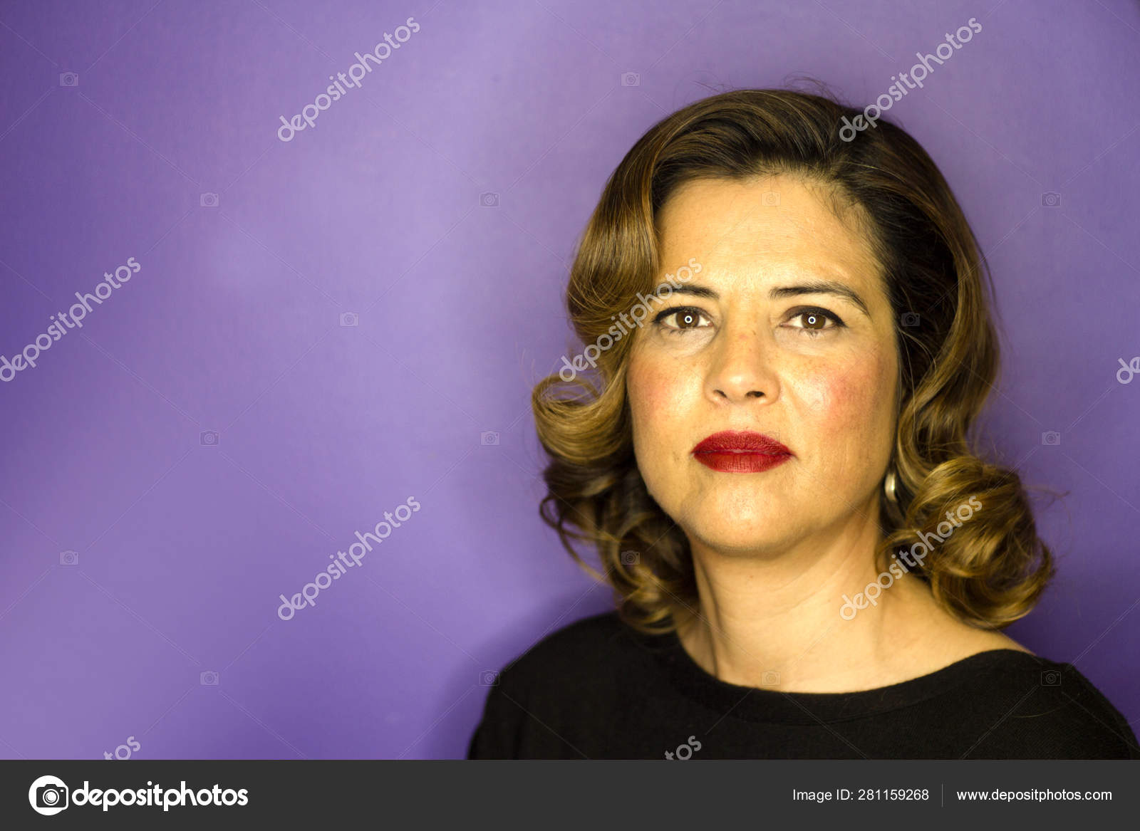 Portrait Of Woman With Brown Hair And Waves 40s Stock Photo