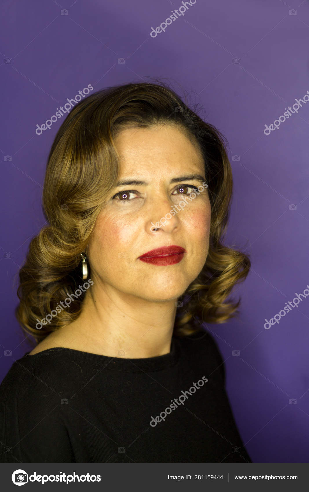 Portrait Of Woman With Brown Hair And Waves 40s Stock Photo