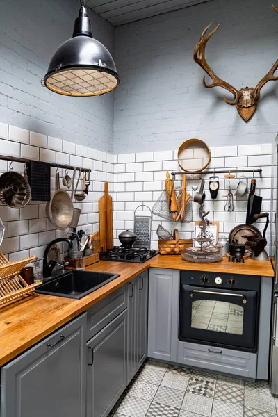 Kitchen in Scandinavian style. comfortable, practical interior. antlers on wall. — Stock Photo, Image