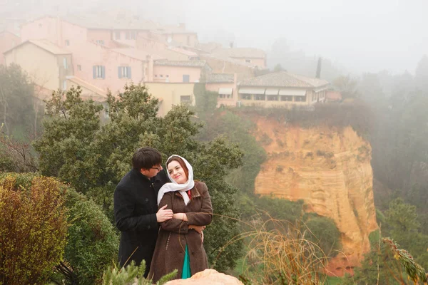 man and a woman. fog and rain, scenic small village in hills of Provence,
