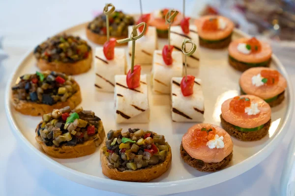 Catering. canapes. snacks for holiday. small sandwiches. — Stock Photo, Image