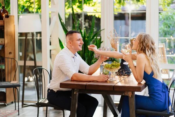 Romantic dinner for couple. lovers drink wine from glasses. — Stock Photo, Image