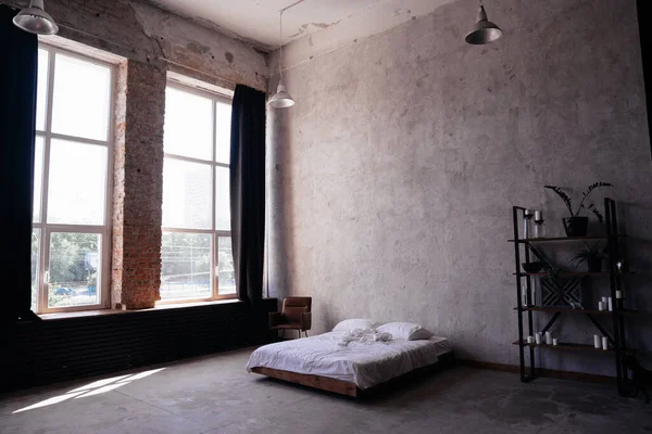 loft. bed, shelving and chair near gray wall and window