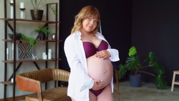 Bodypositive. pregnant woman with overweight in underwear stroking belly. — Stock Video