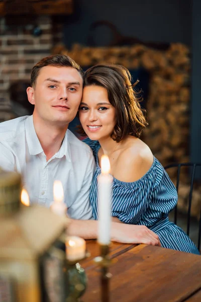 Loving couple on romantic dinner with candles. — Stock Photo, Image