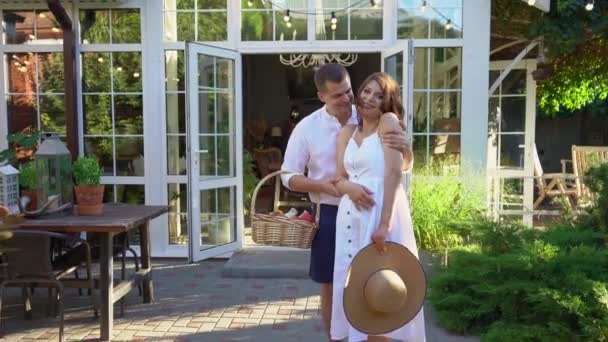 Happy couple, waiting for baby, in garden in backyard. — Stock Video