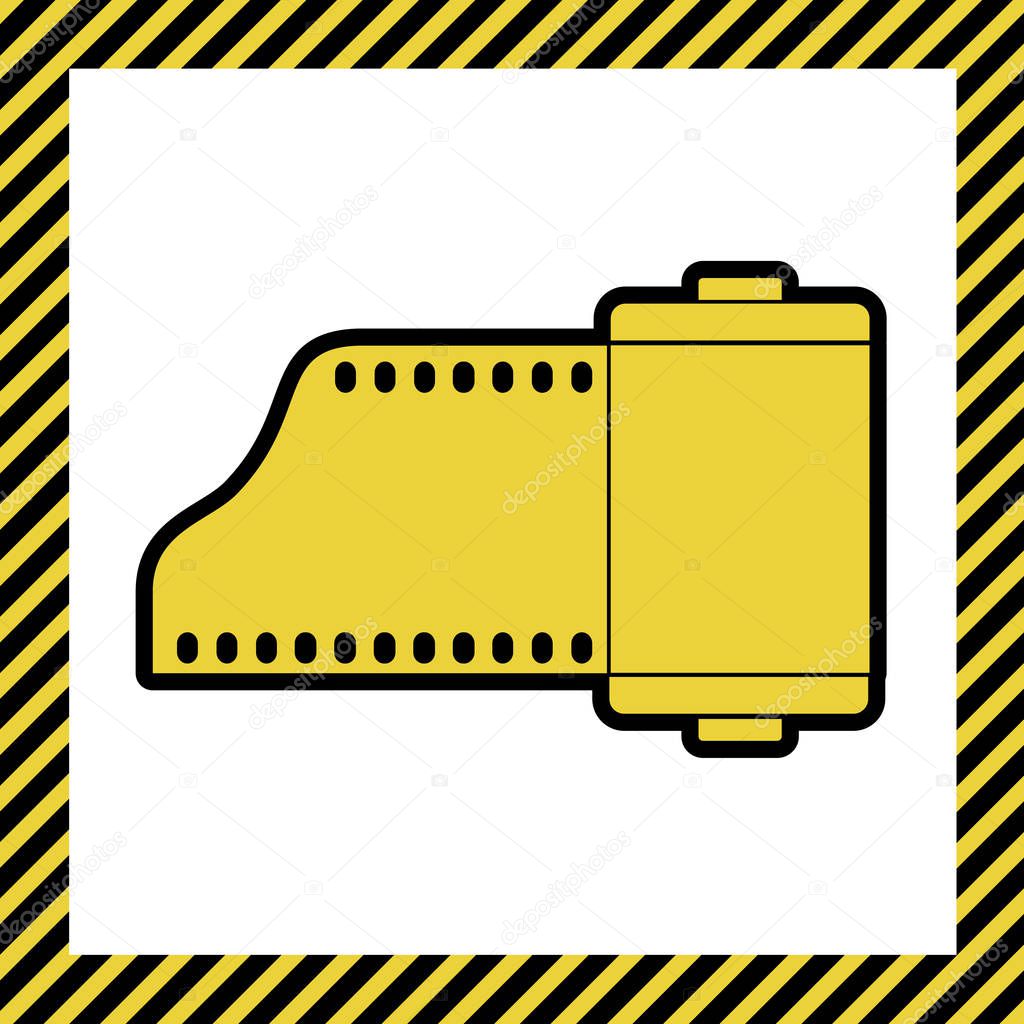 Old photo camera casset sign. Vector. Warm yellow icon with black contour in frame named as under construction at white background. Isolated.