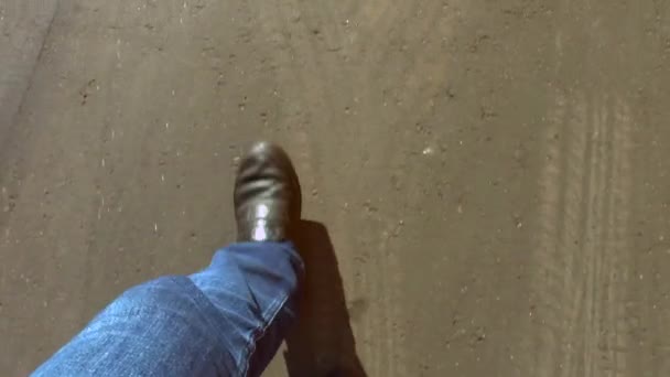 Man Walks Asphalt Road Legs Denim Pants Dark Boots Top — Stock Video