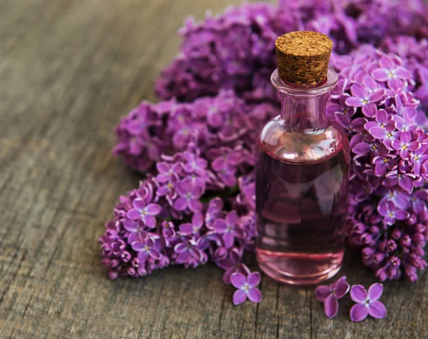 Essential Oil Lilac Flowers Old Wooden Background — Stock Photo, Image