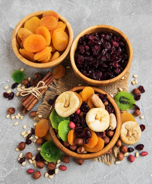 Mixed dried fruits on a gray stone table