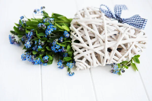 Forget-me-nots flowers  on a white  wooden background