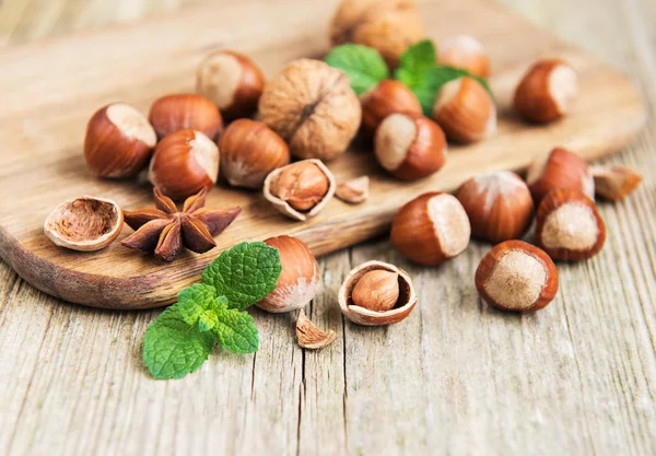 Wooden Board Hazelnuts Old Wooden Table — Stock Photo, Image