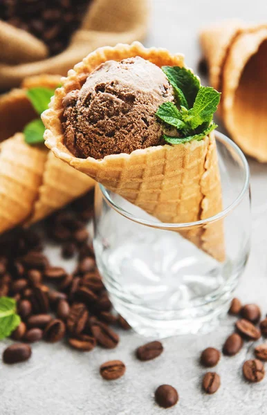 Coffee ice cream and coffee beans on a old wooden table