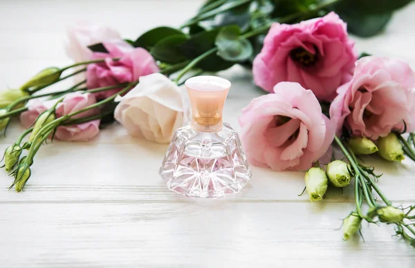 Perfume Bottles Flowers White Wooden Table — Stock Photo, Image