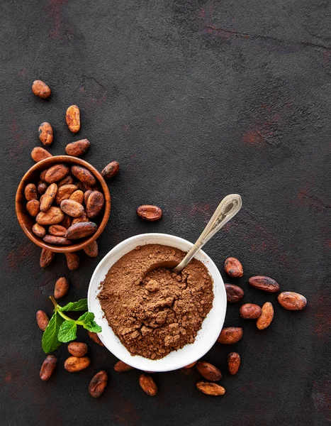 Bowl with Cocoa powder and beans — Stock Photo, Image