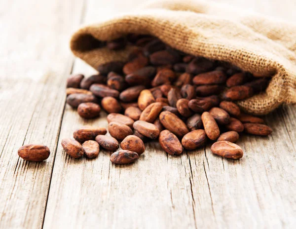 Raw Cacao Beans Burlap Bag Wooden Table — Stock Photo, Image