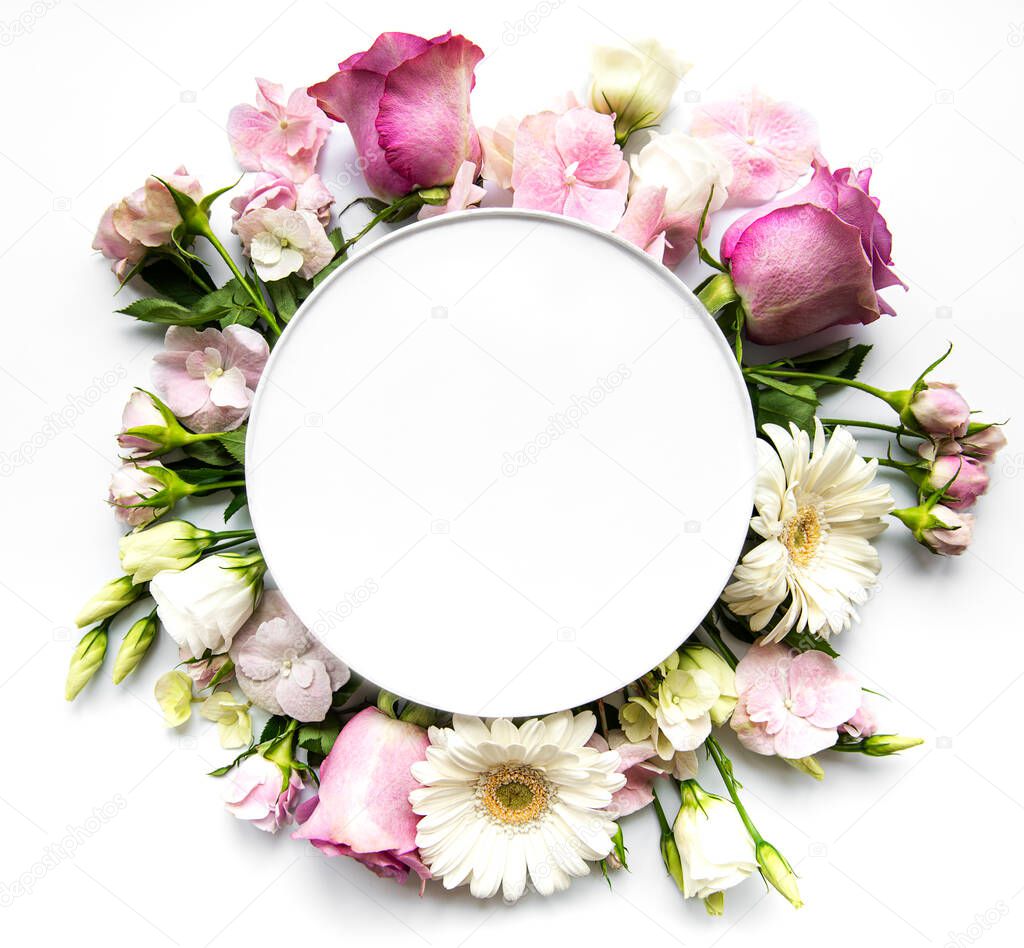 Pink roses and  flowers in round frame with white circle for text  on white background