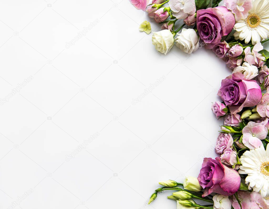 Framework from flowers on white background. Flat lay.