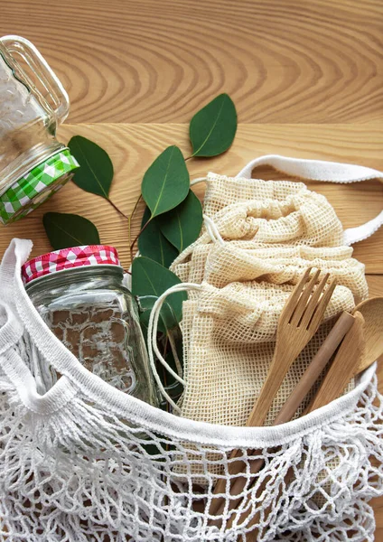 Cotton bags, net bag with reusable  glass jars and bamboo cutlery. Zero waste concept. Eco friendly. Flat lay