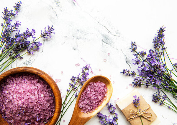 Natural herb cosmetic with lavender,  flatlay on white marble background,  top view