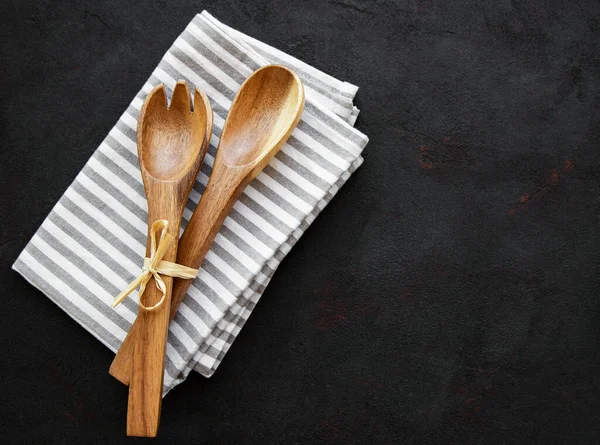 Two Wooden Salad Spoons Napkin Black Background Flat Lay — Stock Photo, Image