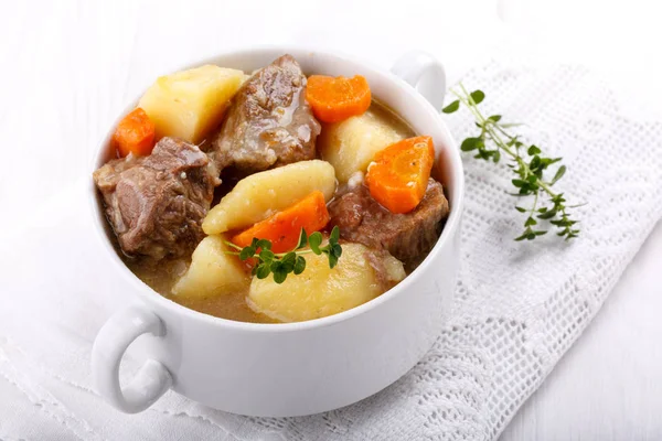 Meat stew with potatoes and carrots.