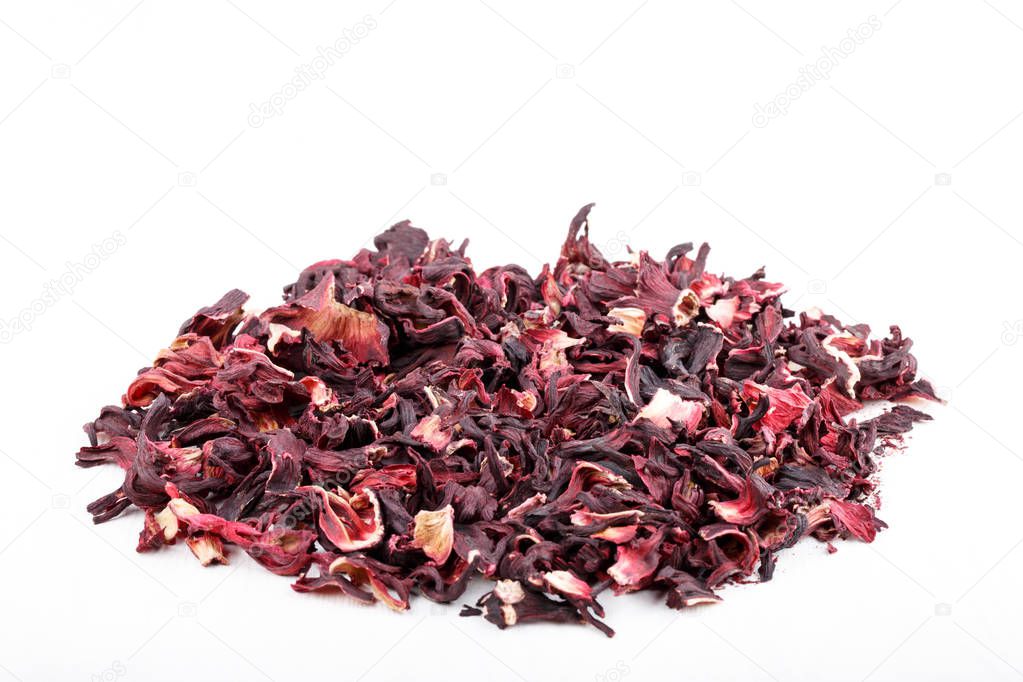 Heap of red herbal tea. Dried petals of hibiscus.