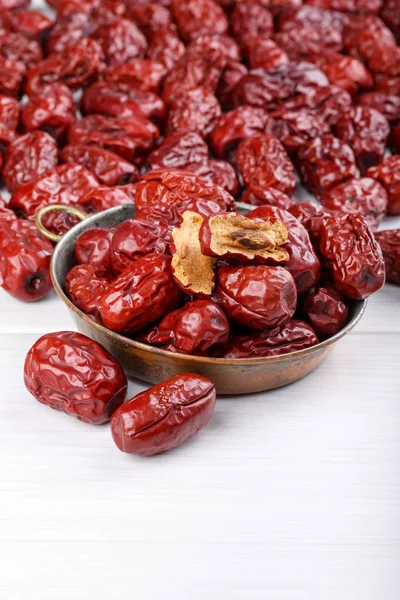 Dried jujube fruits, red dates on white