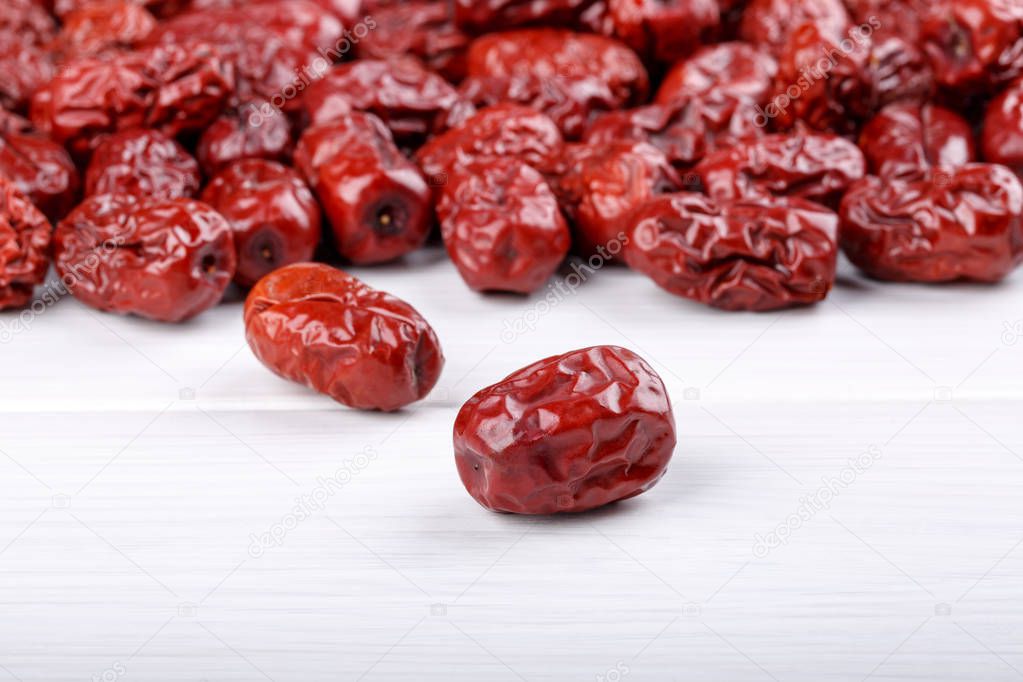 Dried jujube fruits, red dates on white