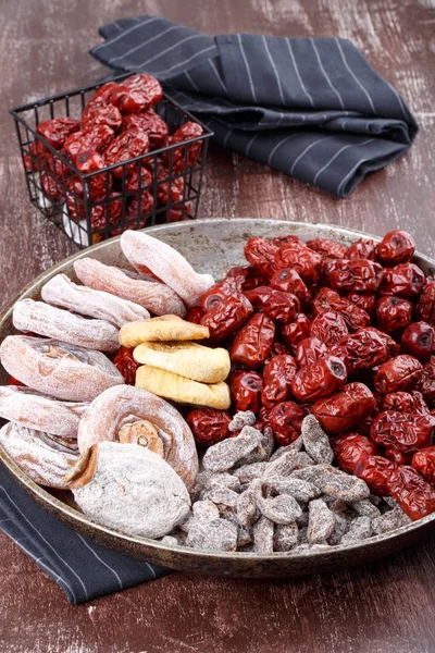 Dried fruits - persimmon, figs, red dates or jujube and salted sliced plum.