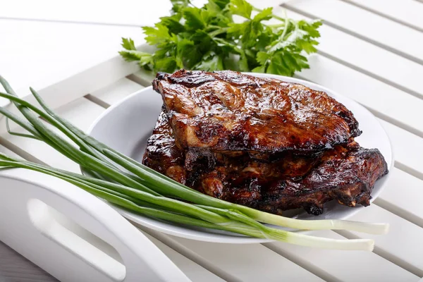 Grilled pork ribs. Meat bbq ribs on white tray — Stock Photo, Image