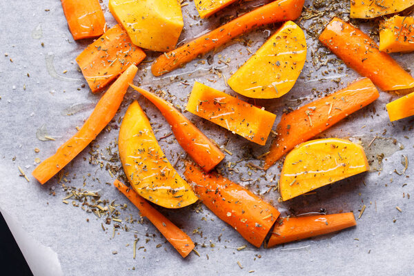 Chopped fresh carrot and pumpkin with herbs and olive oil. 