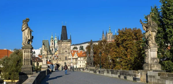 Prague - Charles Bridge and St. Nicolas Church — стокове фото