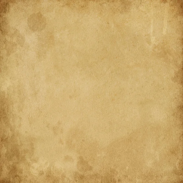 Old brown vintage paper with spots and streaks for design , empty space for text , texture of dirty rough paper