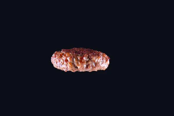 Fried fresh large beef burger isolated on white background. Grilled burger cutlet isolated on black — Stock Photo, Image