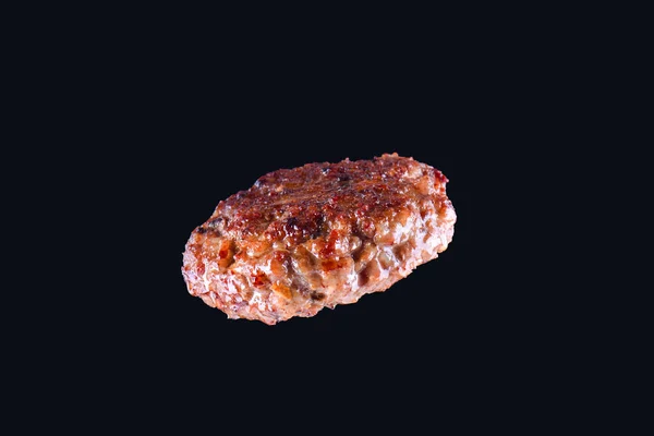 Fried fresh large beef burger isolated on white background. Grilled burger cutlet isolated on black — Stock Photo, Image