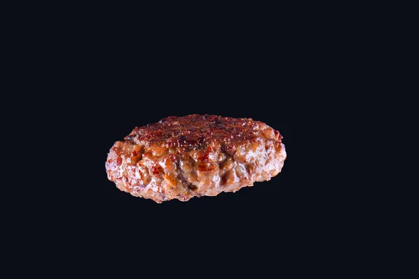 Fried fresh large beef burger isolated on white background. Grilled burger cutlet isolated on black — Stock Photo, Image