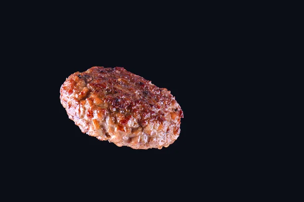 Fried fresh large beef burger isolated on white background. Grilled burger cutlet isolated on black — Stock Photo, Image