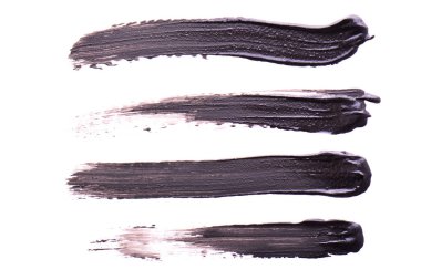 Set of Black strokes of mascara on a white background. Texture of black mascara for eyelashes isolatedon white. Smear of black mascara for eyelashes. Black mascara or paint smears clipart